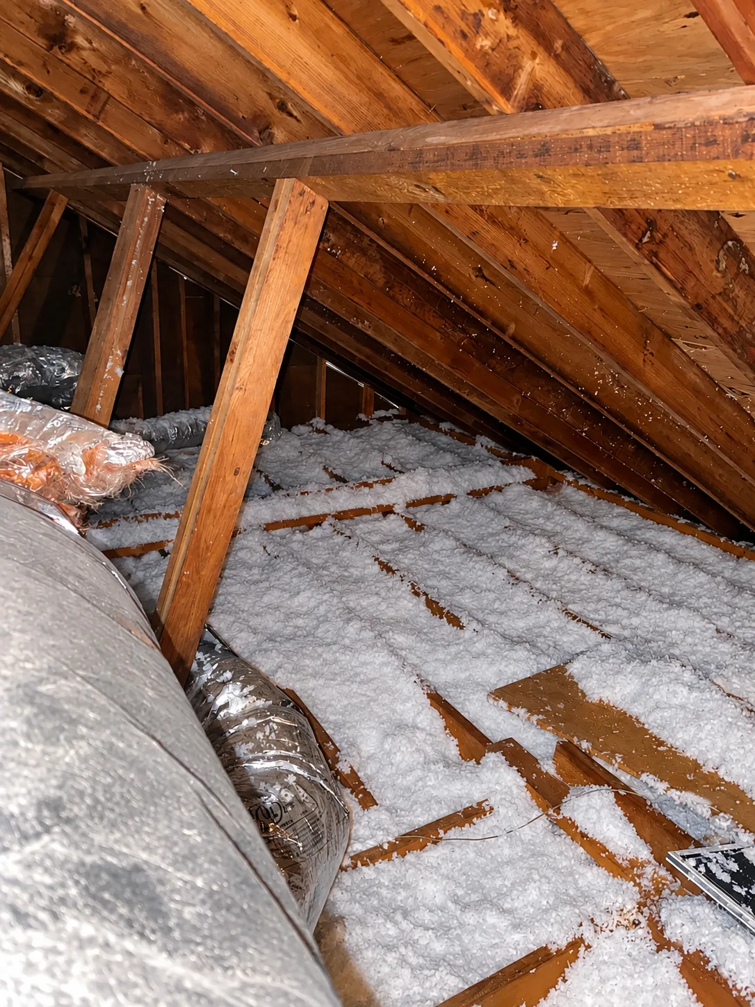 Blown-in insulation between attic joists